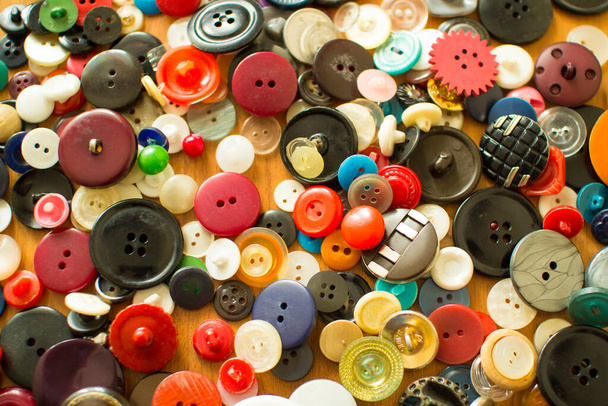 Old colored buttons on table. Needlework. Sewing. background. top view. - Φωτογραφία, εικόνα