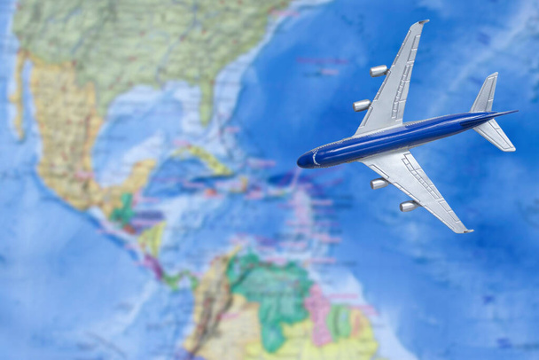 Toy plane on the map. Air trip to Central America. Travel by plane. Flight to Central America concept. - Zdjęcie, obraz