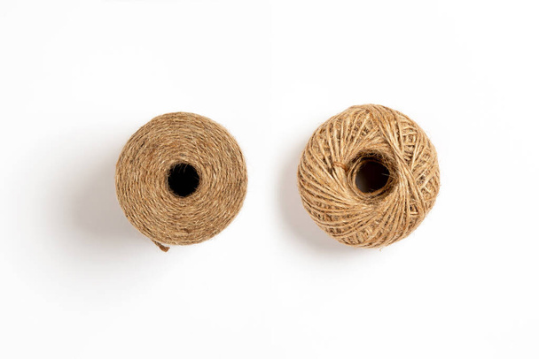 A skein of linen string, cord isolated. Coil of twine. Jute rope. Hemp thread isolated. A skein of brown wool for knitting on a white background. High-resolution photo. - Photo, Image