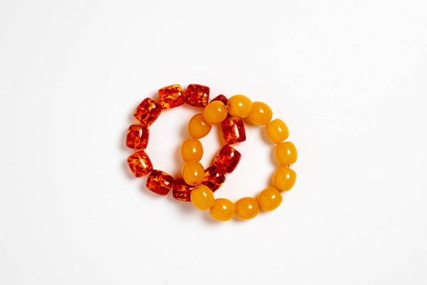 Amber material prayer beads (rosary) on white background.High-resolution photo. - 写真・画像