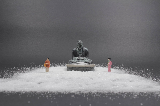 the figure with Zen buddha and  sand  - Фото, зображення
