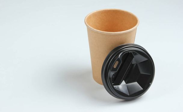 Disposable empty coffee cup with natural materials on a white background. Eco friendly concept - Φωτογραφία, εικόνα