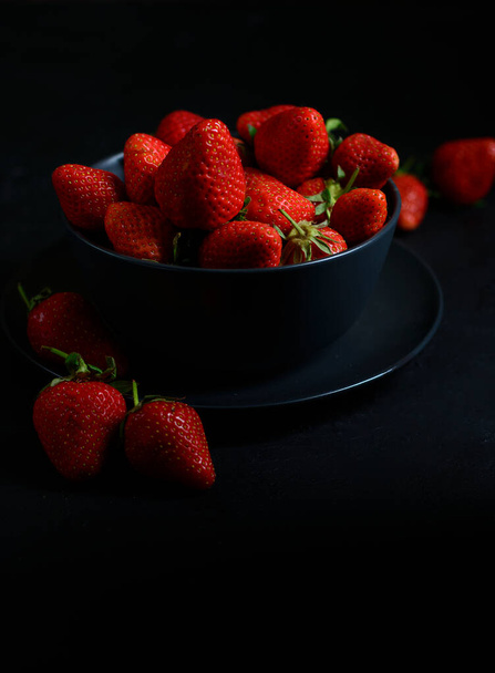 strawberry on a black background levitation - 写真・画像