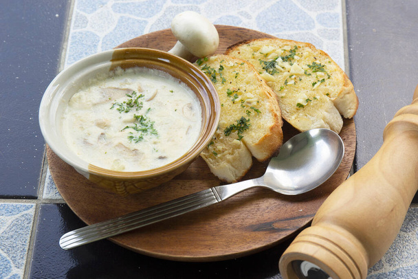 Garlic Bread and Cream Mushroom Soup on the woodplateg - Photo, Image