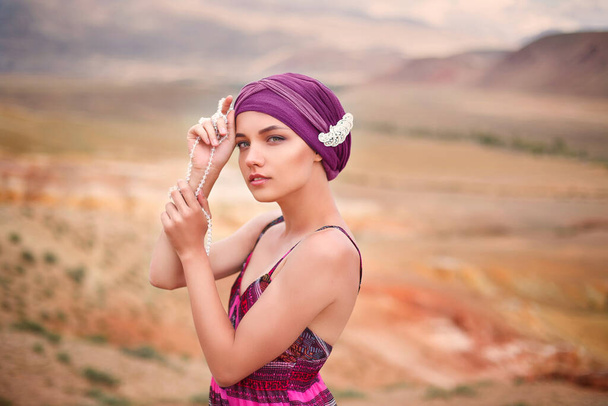 a beautiful girl in an oriental image walks in the desert, Altai Mars, Chagan Uzun, Kyzy-Chin - Photo, Image