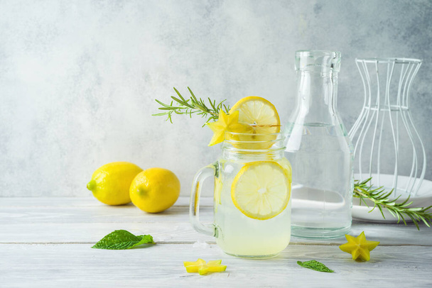 Summer lemonade drink on wooden table - Фото, зображення