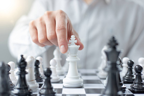 Business men make plans to play chess with Prudence and success, Management or leadership concept. - Photo, Image