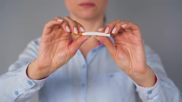 Quit smoking concept, woman breaks a cigarette. - Footage, Video
