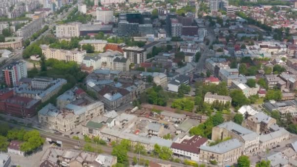 View from the height on Lviv, Ukraine: old and new buildings mixed on the city streets - Materiał filmowy, wideo
