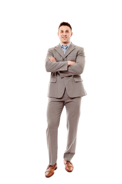 Cheerful businessman with arms folded - 写真・画像