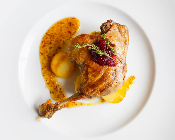 roasted duck leg with potato and mustard sauce, top view - Zdjęcie, obraz