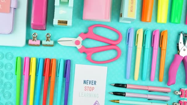 Back to school or workspace colorful stationery overhead flatlay. - Footage, Video