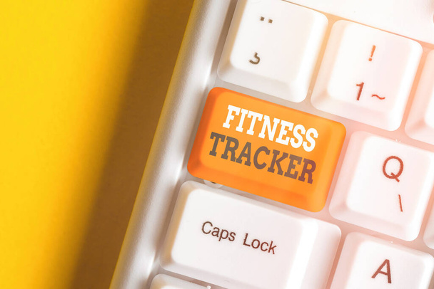 Writing note showing Fitness Tracker. Business photo showcasing a monitoring device that records any healthrelated activity. - Photo, Image