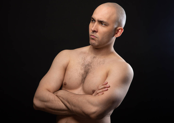 Photo of bald thinking man with bare shoulders - Foto, Bild