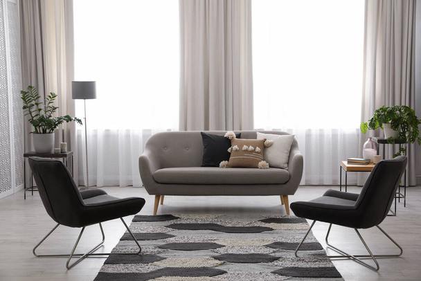 Modern living room interior with comfortable sofa and armchairs - Fotoğraf, Görsel
