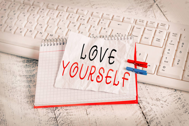 Handwriting text Love Yourself. Concept meaning accepting the overall aspect of ourselves and have selfrespect notebook paper reminder clothespin pinned sheet white keyboard light wooden. - Photo, Image