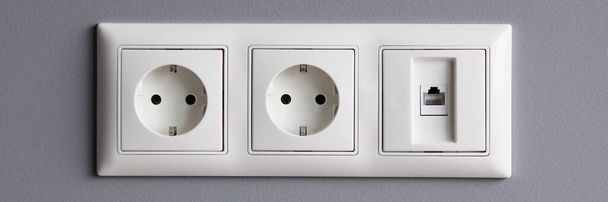 Modern white house outlet on gray wall closeup - Фото, зображення