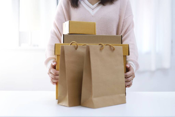 Business From Home woman preparing package delivery box Shipping for shopping online. young start up small business owner at home online order  - Foto, imagen