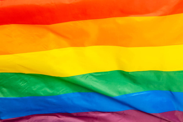 The Rainbow Flag, used as a symbol of lesbian, gay, bisexual, transgender, and queer (LGBTQ) pride and LGBTQ social movements. - Фото, изображение