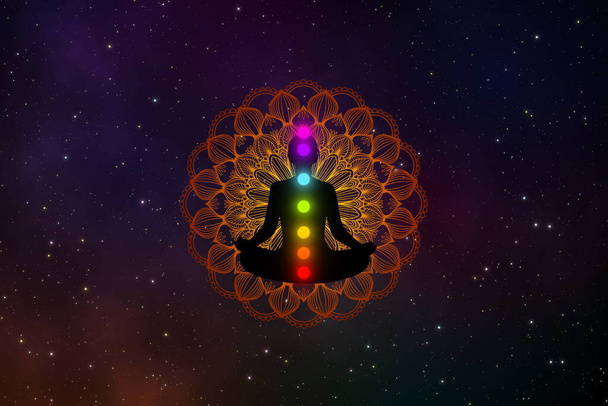 Abstract silhouette meditation man with seven chakras  and precious mandala in the galaxy. - Photo, Image