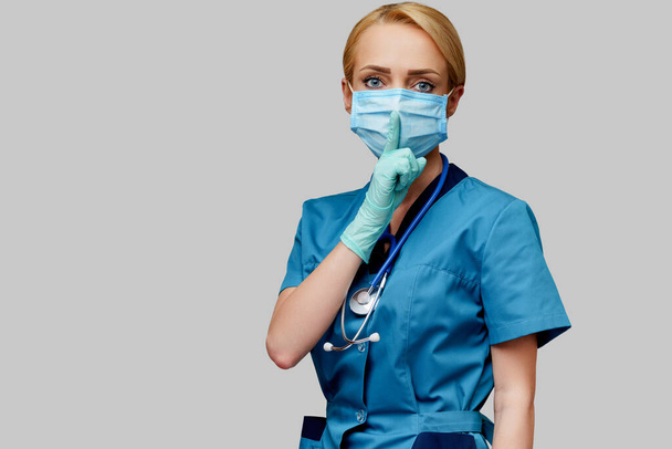 medical doctor nurse woman with stethoscope wearing protective mask and rubber or latex gloves - Zdjęcie, obraz