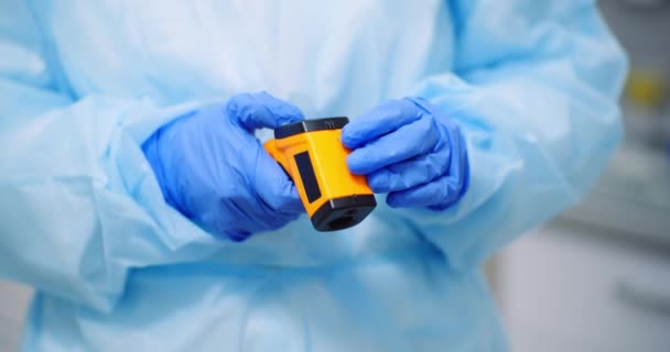 Doctor Holding Non-contact Infrared Thermometer - Footage, Video