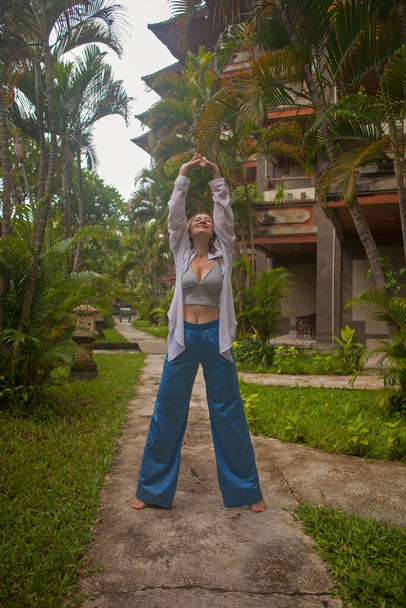 Young woman having fun in natural Bali environment - Фото, зображення