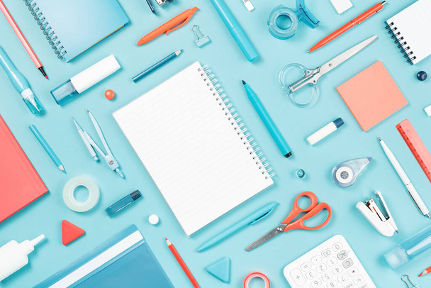 Assorted office and school white blue and orange stationery - 写真・画像