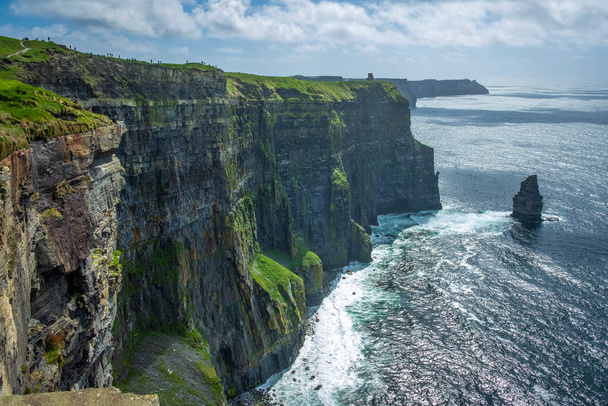 walking at the very spectacular Cliffs of Moher, Co Clare, Ireland - Photo, Image