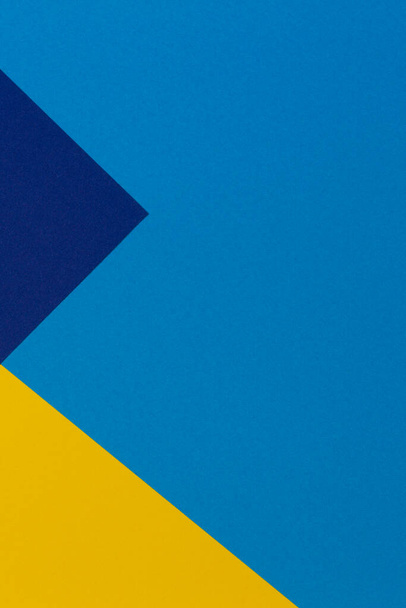 Creative abstract blue and yellow color geometric paper compositon background, top view - Photo, Image