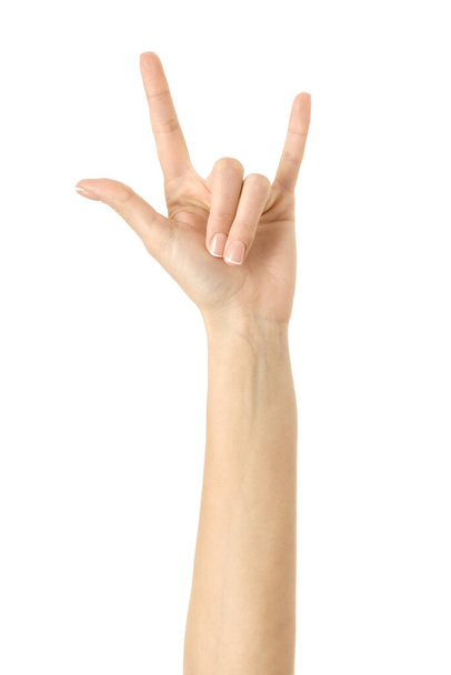 Rock and roll! Woman hand with french manicure gesturing isolated on white background. Part of series - 写真・画像
