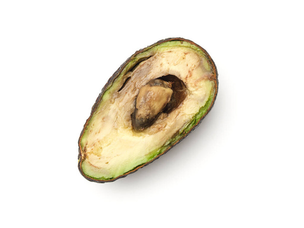 Rotten overripe halved avocado isolated on white background. Top view - Zdjęcie, obraz