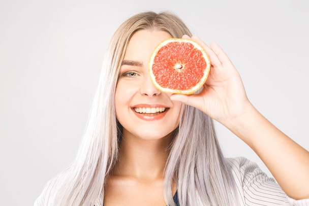 Beauty woman with orange citrus grapefruit with healthy skin body. Attractive fresh vitamin. Isolated over white. - Photo, Image