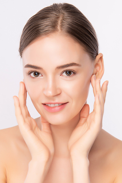Beautiful Young Woman touching her clean face with fresh Healthy Skin, isolated on white background, Beauty Cosmetics and Facial treatment Concept. - Φωτογραφία, εικόνα