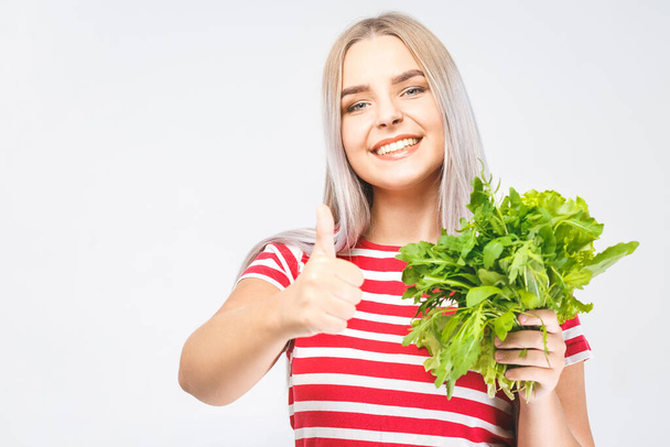 Portrait of happy woman with lettuce isolated over white background. Food healthy concept. Thumbs up.  - Photo, Image