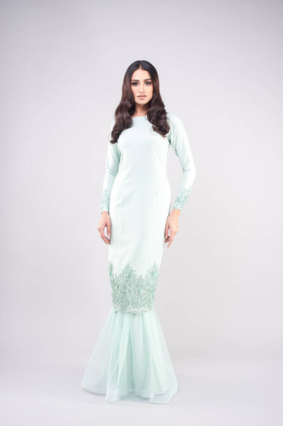 Beautiful female model wearing Malaysia traditional cloth or dress known as "BAJU KURUNG". AIDILFITRI FASHION. - Foto, Imagem