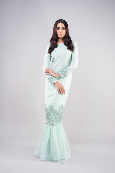 Beautiful female model wearing Malaysia traditional cloth or dress known as "BAJU KURUNG". AIDILFITRI FASHION. - Fotoğraf, Görsel
