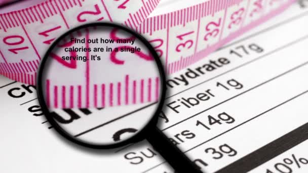 Magnifying glass on nutrition facts - Footage, Video
