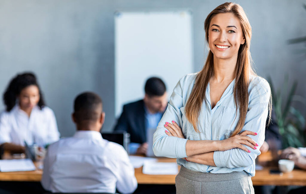 Successful Businesswoman Posing Standing In Modern Office During Meeting - Фото, зображення