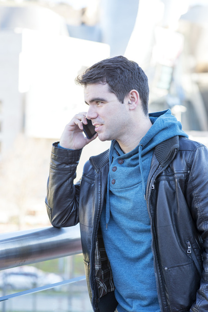 Portrait of man talking by phone, outdoor. - Photo, Image