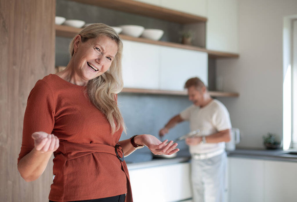 friendly sweet woman inviting to her kitchen . - Photo, Image