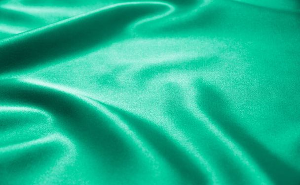 Green satin fabric as background - Foto, immagini