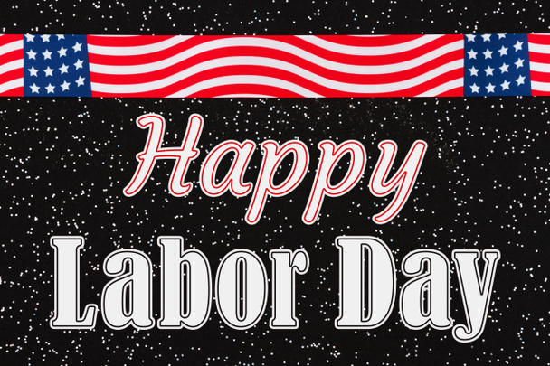 Happy Labor type message with USA stars and stripes ribbon on black sparkle felt - Photo, Image