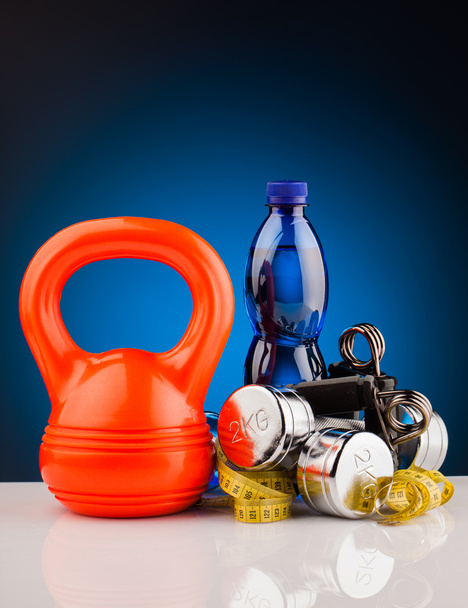 fitness dumbbells and bottle of water - Photo, Image