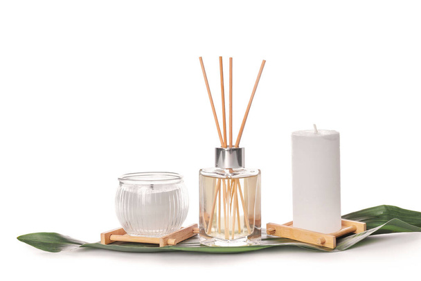 Reed diffuser and candles on white background - Photo, Image