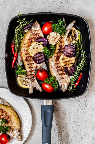 Grilled Skimmer Breams with Vegetables and Herbs, copy space for your text - Fotó, kép