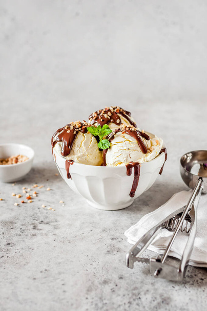 Vanilla Ice Cream Scoops with Chocolate Ganache and Chopped Nut Topping, copy space for your text - Фото, зображення