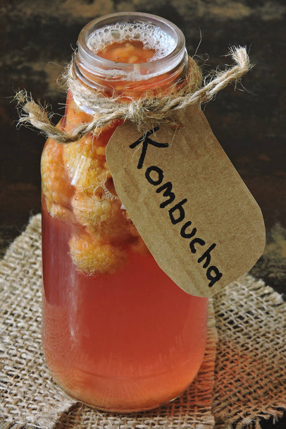 Homemade kombucha with ginger and cinnamon. Recipe cooking kombucha. Kombucha tea with cinnamon, ginger and spices. Fermented drink. Probiotics. Fermented beverages. Copy space. - Photo, Image