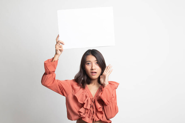 Young Asian woman surprise with white blank sign on white background - Foto, immagini
