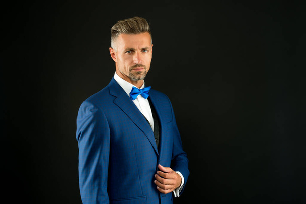 your signature look. sexy adult man in stylish tuxedo. male fashion and beauty. handsome man has graying unshaven face. skilled sommelier. bride groom on wedding day. event host wear bow tie - 写真・画像
